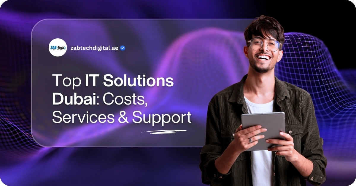 A purple-themed promotional banner with a futuristic, wavy grid pattern in the background. A young, smiling man with glasses is on the right side of the image, holding a tablet and looking directly at the camera. He is wearing a dark, corduroy-like jacket over a white t-shirt. On the left side, a large, translucent, rounded rectangle contains the text "Top IT Solutions Dubai: Costs, Services & Support". The words "IT Solutions" are highlighted in bold. At the top left of the rectangle, the logo for "ZAB-Tech" is visible along with the website address "zabtechdigital.ae". The design is modern, professional, and tech-oriented.