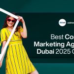Best Content Marketing Agency Dubai 2025 Guide A lively promotional banner for a content marketing agency. The background is a dark teal color. On the left side, two young women are smiling and posing. The woman on the left has curly hair, is wearing sunglasses and a dark red patterned dress, and is holding a large white cutout frame shaped like an Instagram post. The woman on the right is wearing sunglasses and a bright yellow striped dress with a white belt and is smiling. On the right side of the banner, contained within a large, rounded black overlay, is the text: "Best Content Marketing Agency Dubai 2025 Guide". At the top of this section, the logo for ZAB-Tech and the website address "zabtechdigital.ae" are visible. The overall design is energetic, modern, and focused on digital and content marketing.